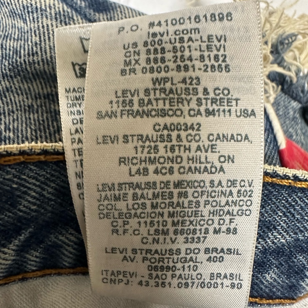 Levi's Distressed Denim Cutoff Shorts with American Flag Pocket - Picture 4 of 7